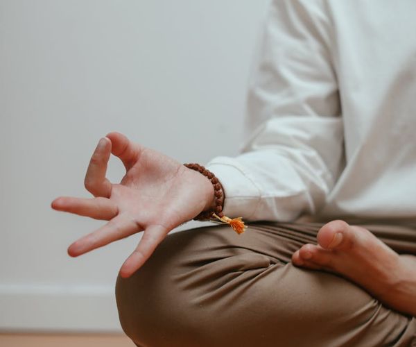 Person meditating peacefully, representing inner energy and calm focus.